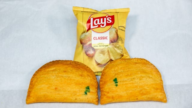 2 Jamaican Curry Chicken Patties + Bag of Chips.